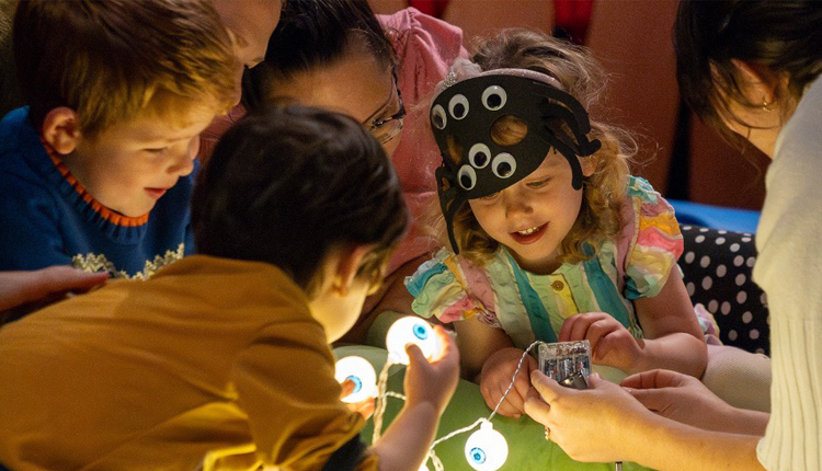 children looking at touch screens